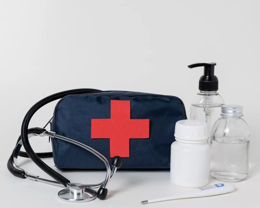 front view composition of medical kit with stethoscope and medic elements